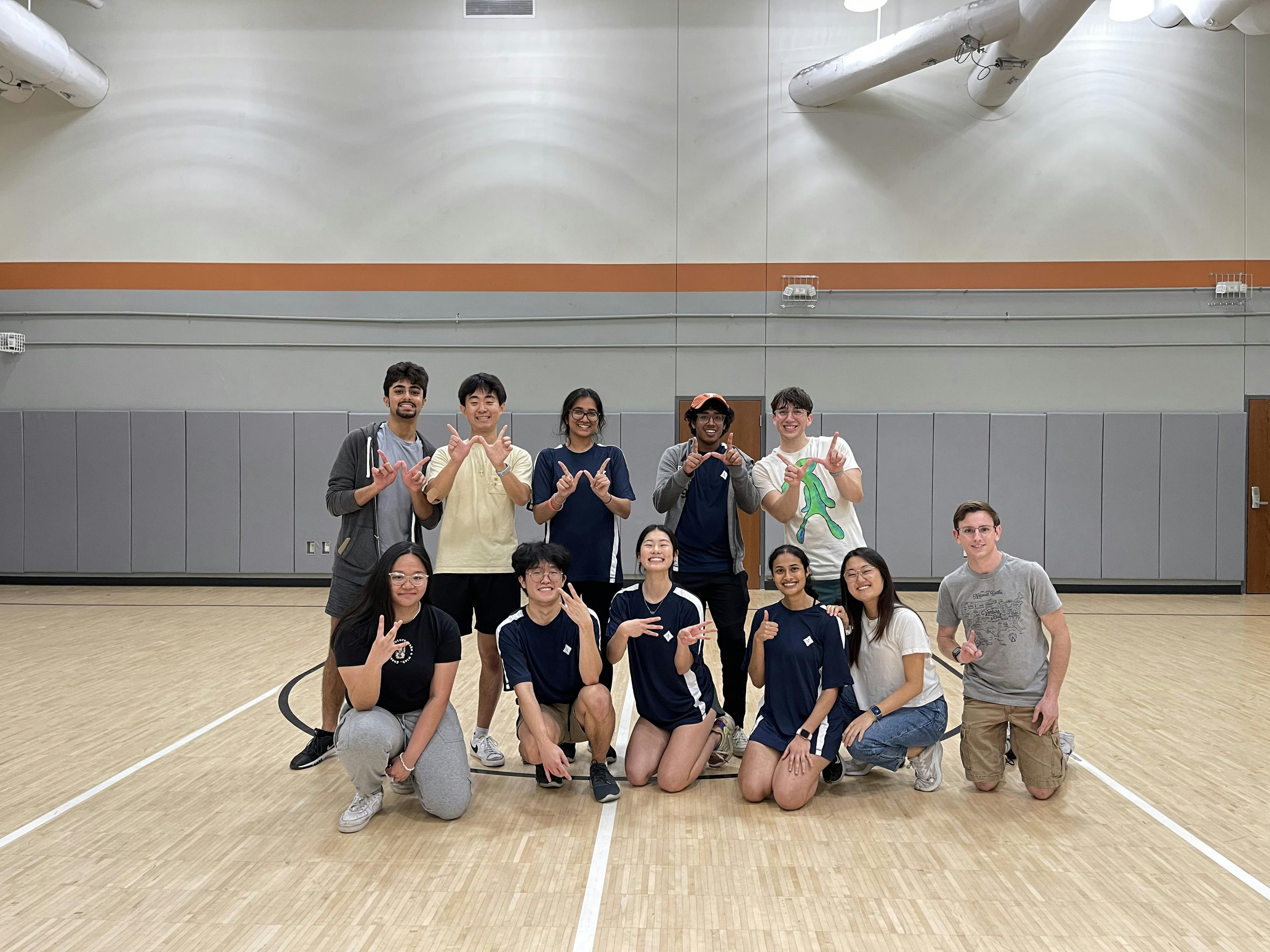 Group photo of IEEE members in uniform on court after a dodgeball game