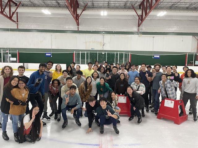 IEEE and IEEE RAS group photo in the middle of an iceskating rink.